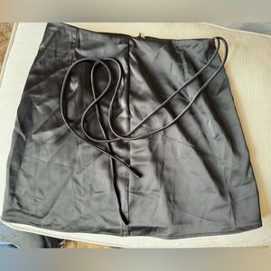 Black shiny skirt with rope belt